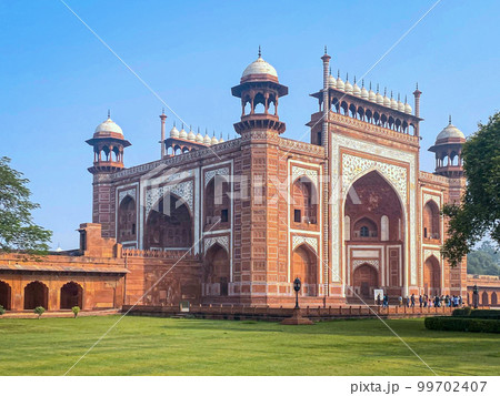 The famous red fort in the city of Agra, India. Tourists visit a popular tourist attraction. 99702407