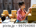 Asian teenager owner business woman work at home for online shopping and sale. 99704060