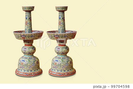 old two yellow and red ceramic candle holder on yellow background, object, decor, banner, template, vintage, fashion, old, copy space 99704598