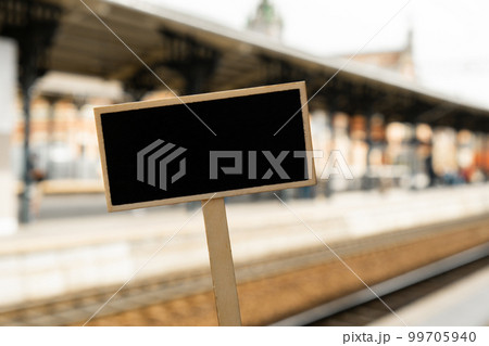 Empty mockup template Blackboard label against defocused background railway station with locomotive. Advertisement Eco Transportation Concept Eco-friendly modes of transport Copy space for text Empty mockup template Blackboard label against defocused background railway station with locomotive. Advertisement Eco Transportation Concept Eco-friendly modes of transport Copy space for text 99705940