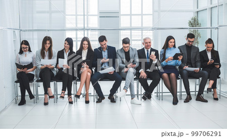 group of business people use their gadgets before starting a business meeting 99706291