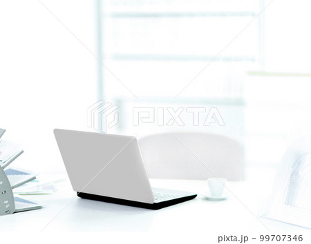 Demonstration laptop in the office, rear view. Workplace of the businessman Demonstration laptop in the office, rear view. Workplace of the businessman 99707346