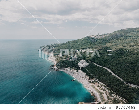 Christian church in the mountains above the sea. Temple of the Holy Archangel Michael in Oreanda. The southern coast of Crimea. Aerial view Christian church in the mountains above the sea. Temple of the Holy Archangel Michael in Oreanda. The southern coast of Crimea. Aerial view 99707468