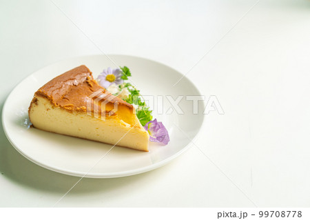 Basque Burnt Cheesecake on plate Basque Burnt Cheesecake on plate 99708778