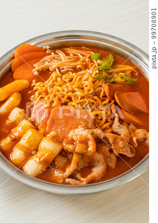 Budae Jjigae or Budaejjigae (Army stew or Army base stew). It is loaded with Kimchi, spam, sausages, ramen noodles and much more Budae Jjigae or Budaejjigae (Army stew or Army base stew). It is loaded with Kimchi, spam, sausages, ramen noodles and much more 99708901