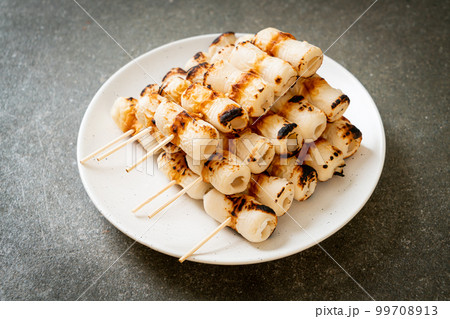 grilled tube shaped fish paste cake skewe or tube squid skewer 99708913
