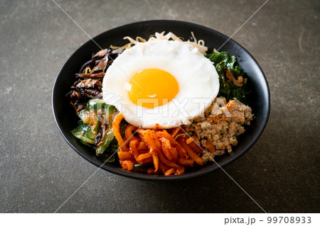 Korean spicy salad with rice - traditionally Korean food, Bibimbap Korean spicy salad with rice - traditionally Korean food, Bibimbap 99708933