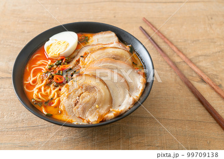 Ramen Noodles Spicy Tomyum Soup with Roast Pork 99709138