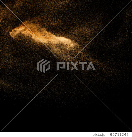 Sand explosion isolated on black background. Freeze motion of sandy dust splash.Sand texture concept. 99711242