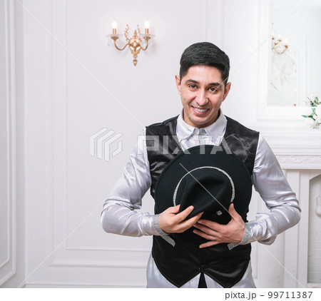 male actor takes off his hat greeting you 99711387