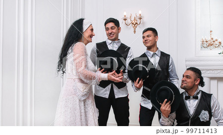 group of actors greeting a female performer 99711413