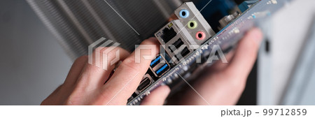 Motherboard hand holder port in laptop computer closeup 99712859