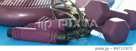 Room with equipment for home workouts and fitness 99712972