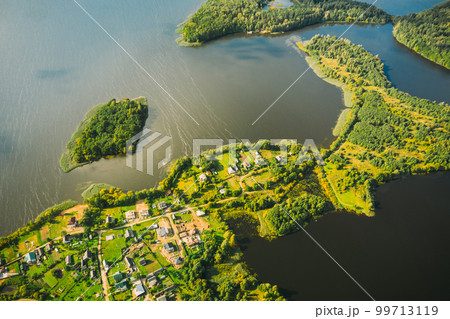 Lyepyel District, Lepel Lake, Beloozerny District, Vitebsk Region. Aerial View Of Residential Area With Houses In Countryside. Top View Of Island Pension Lode From High Attitude In Autumn Sunny Day 99713119