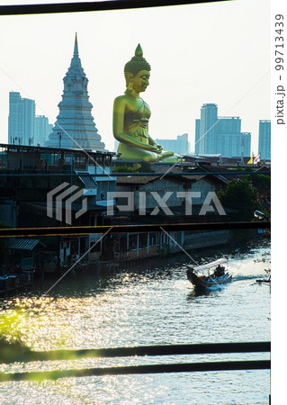 landscape of big buddha in the city large Buddha statue  in Bangkok (Wat Pak Nam Phasi Charoen) Thailand 99713439