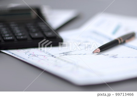 close up.pen, financial chart and calculator on the businessman's Desk 99713466