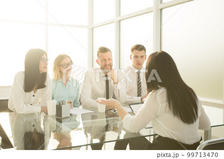 group of HR managers interview a young female candidate group of HR managers interview a young female candidate 99713470