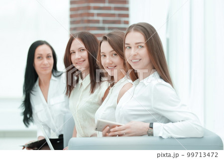 group of successful business woman sitting in office hall.photo with copy space group of successful business woman sitting in office hall.photo with copy space 99713472
