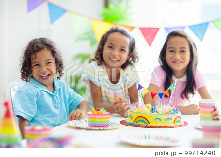 Kids birthday party. Children with cake and gifts 99714240