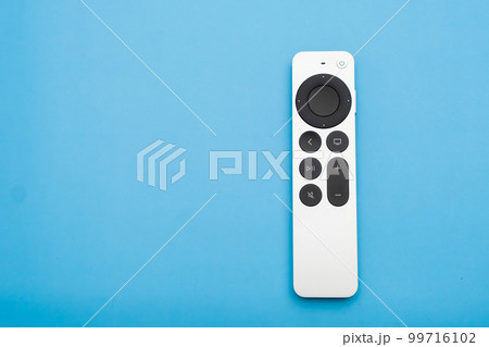 Siri Apple Tv 4k Remote controller on the blue background with copy space, February 2023, Prague, Czech Republic Siri Apple Tv 4k Remote controller on the blue background with copy space, February 2023, Prague, Czech Republic 99716102