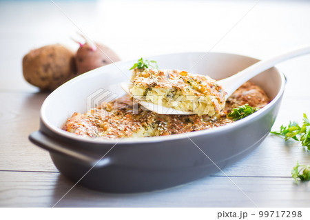 potato casserole with cabbage and spices in a ceramic form 99717298