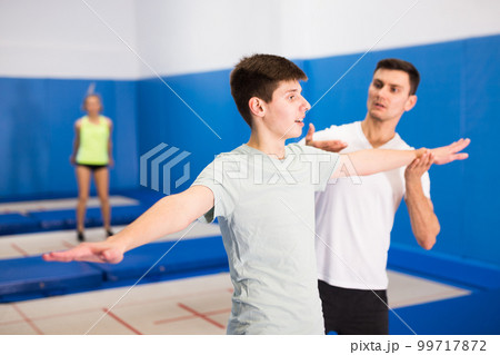 People preparing to trampoline training 99717872
