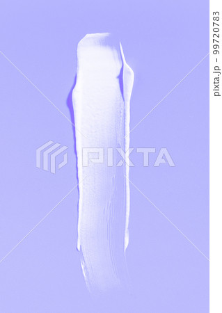 White cream smear on a purple background. Vertical macro photography. 99720783