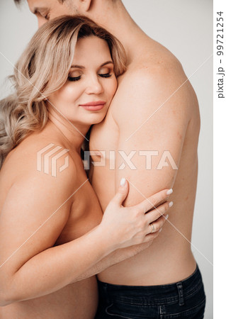 a passionate man and pregnan woman topless in black underwear a passionate man and pregnan woman topless in black underwear 99721254