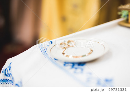 Wedding rings on ceremony at church. Macro. 99721321
