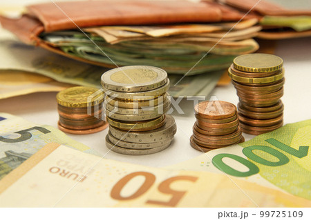 wallet with money, a pile of coins, banknotes background. Concept of saving money. Horizontal, banner, mockup, for your design 99725109
