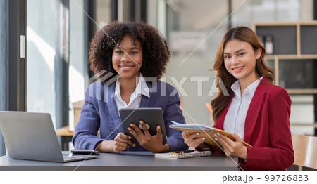 Teamwork of business people analysis graph Asian business woman advisor meeting to analyze and discuss on the financial report 99726833