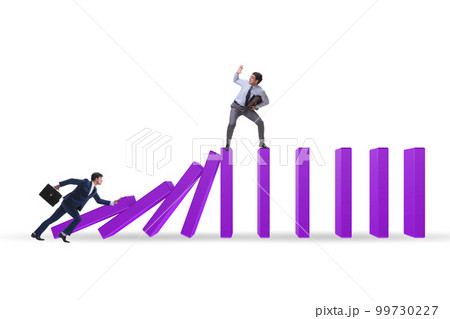 Businessman in domino effect concept 99730227