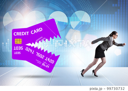 Businesswoman in credit card debt concept Businesswoman in credit card debt concept 99730732
