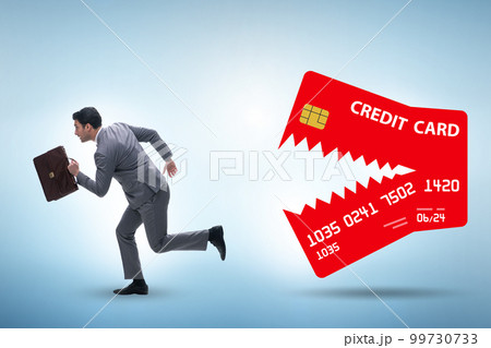 Businessman in credit card debt concept Businessman in credit card debt concept 99730733
