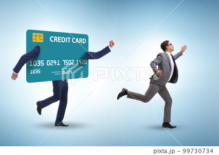 Businessman in the credit card debt concept Businessman in the credit card debt concept 99730734