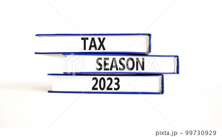 Tax season 2023 symbol. Concept words Tax season 2023 on books on a beautiful white table white background. Business Tax season 2023 concept. Copy space. 99730929