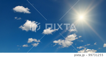 Bright sun on beautiful blue sky with white clouds. Bright sun on beautiful blue sky with white clouds. 99731255