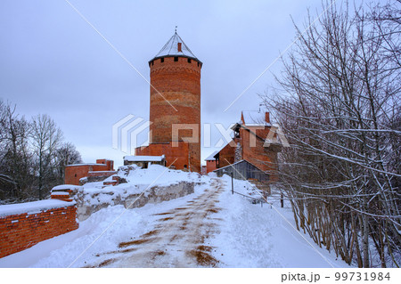 Medieval Turaida Castle complex in winter. Red brick buildings. in the Vidzeme region of Latvia. Gaujas national park. 99731984