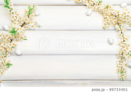 Easter eggs wood. April floral nature, white happy easter eggs on wood spring background. Easter pattern with place for text. Easter eggs wood. April floral nature, white happy easter eggs on wood spring background. Easter pattern with place for text. 99733401