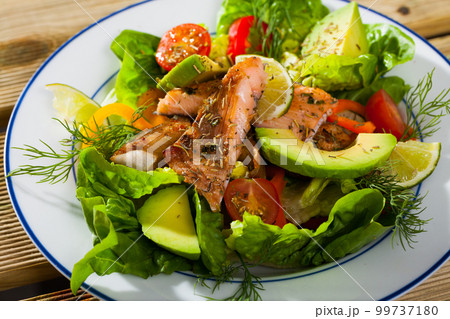 Light tasty salad of grilled trout fillet 99737180