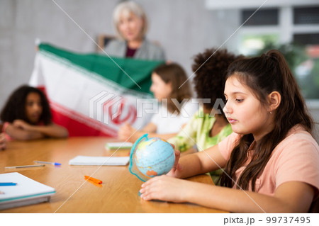 students listen to woman teacher who talks about Iran 99737495