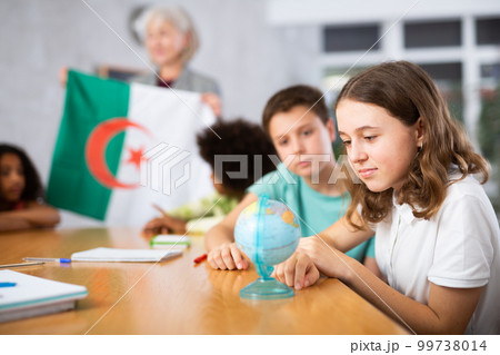 students listen to woman teacher who talks about Algeria students listen to woman teacher who talks about Algeria 99738014