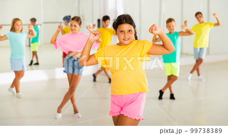 Dance studio - girls and boys in dance lesson 99738389