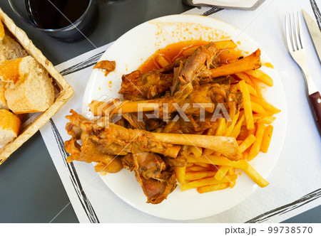 Baked lamb shins from oven with sauce 99738570