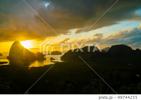 Morning sunrise colorful sky with cloud above sea bay forest with island 99744255