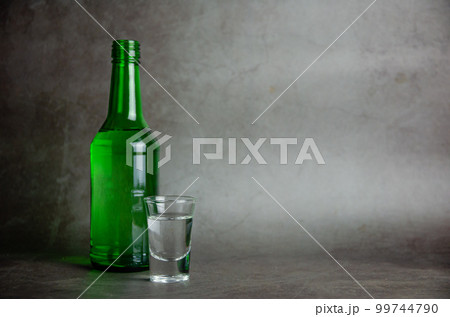 soju with glass on grey background, selective focus 99744790