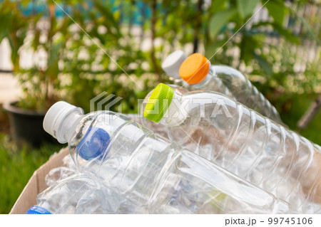plastic bottles in brown recycle garbage box 99745106