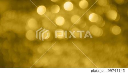 Abstract gold bokeh light festive defocused blur background Abstract gold bokeh light festive defocused blur background 99745145