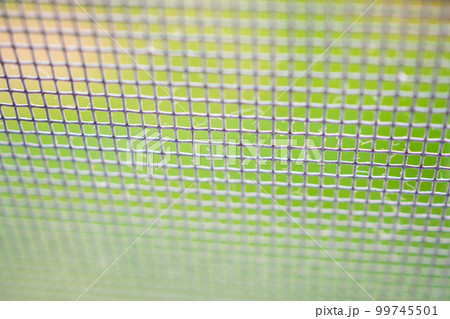 mosquito net wire screen close up on house window protection against insect 99745501