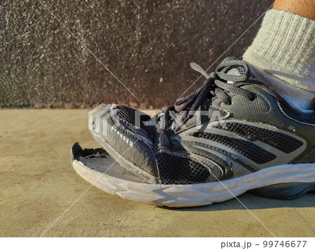 side view of torn shoes, shoes in need of repair side view of torn shoes, shoes in need of repair 99746677